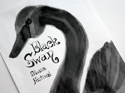 Photograph of a poster for the Black Swan Music Festival shows a left-facing black swan and the music festival title all done in a watercolor-like black ink wash.