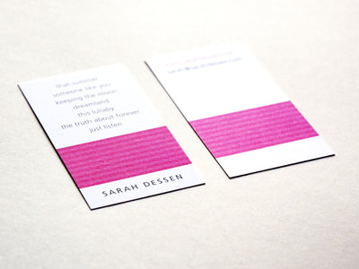 Photograph of the front and back of a white, vertical business card with a bar of medium and dark pink stripes. “Sarah Dessen” is in an all-caps, sans serif font and her books and contact information are in lowercase.