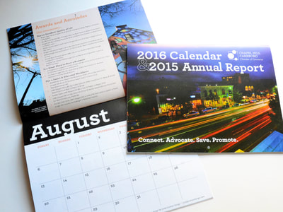Photograph of the Chapel Hill-Carrboro Chamber of Commerce's 2016 calendar and 2015 annual report, showing a cover that features white text reversed out of a colorful nighttime photo of downtown; the August spread is also shown.