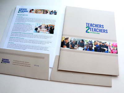 Photograph shows a taupe pocket folder open with a document inside, and with a closed folder on top. The folder has a photo collage bar and a green and blue Teachers 2 Teachers-International Logo.