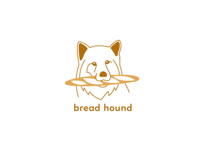 This yellow and gold logo shows an outlined illustration of a dog with a fluffy ruff, holding a baguette in its mouth. The words “bread hound” are below in a lowercase sans serif font.