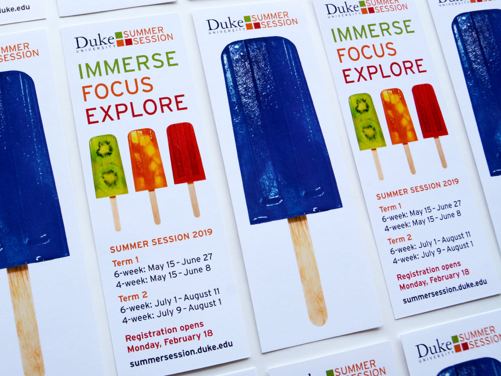 Bookmarks for Duke Summer Session have one Duke blue popsicle on one side and three smaller popsicles in kiwi, orange, and red on the back with information on class sessions.